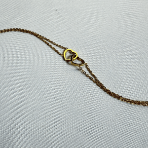 Brazalete dos corazones | Dorado